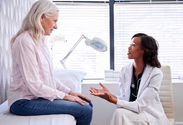 Healthcare provider speaking with patient.