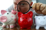 Piggy-banks-magnifying-glass