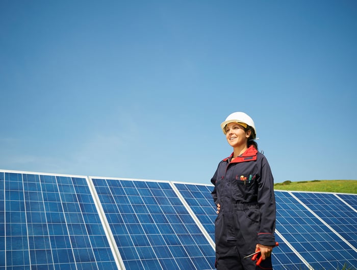 An engineer working on solar panels. 