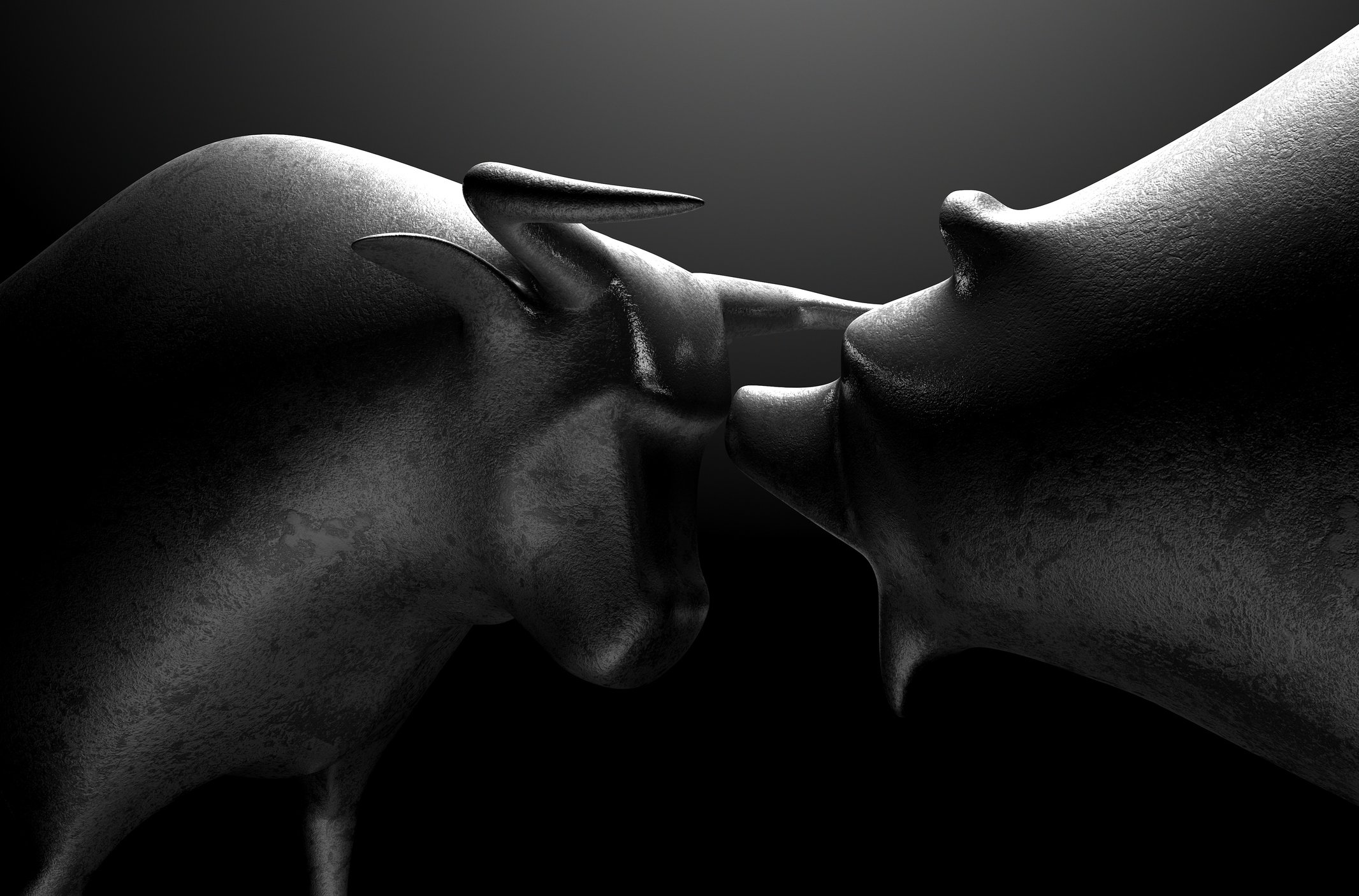 A bull is facing a bear.