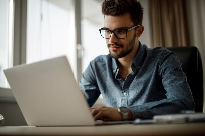 Man looking at laptop screen