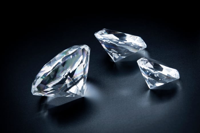 Three glistening diamonds are shown.