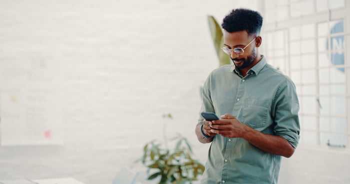 A man uses a smartphone.