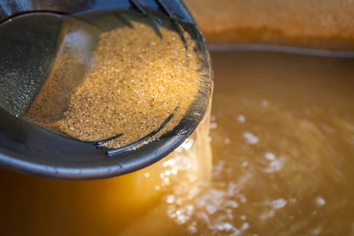 A pan being used to pan for gold.