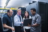 Colleagues working together in a data center