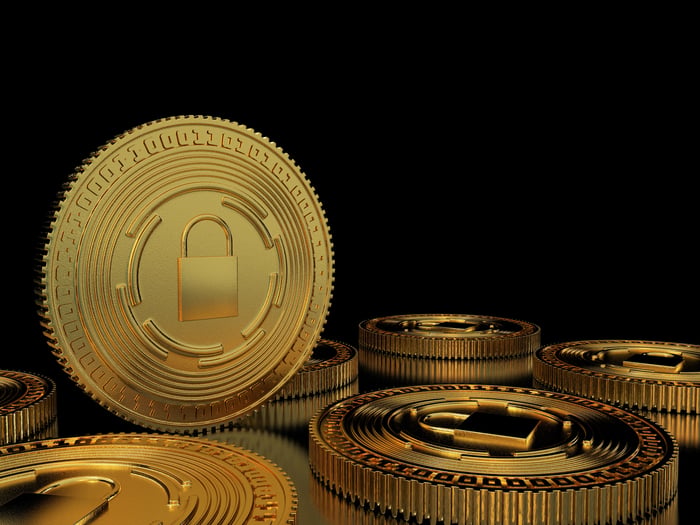 A rendering of coins with a padlock depicted on them.