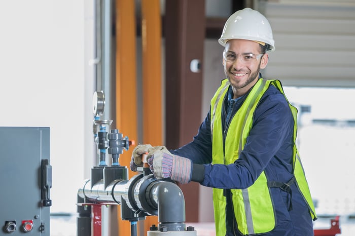 Person working in an oil and gas facility.