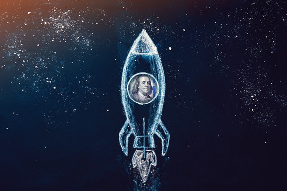 A rocket in space with a hundred-dollar bill inside.