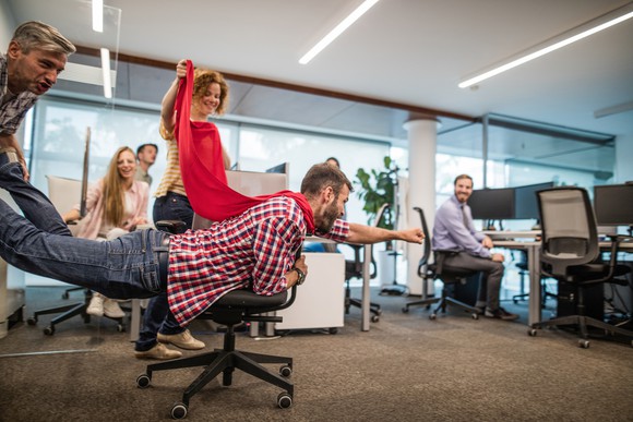 A group of employees having fun at the office.