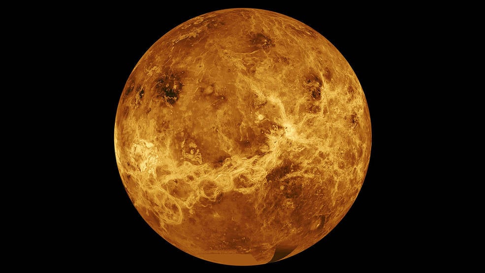 Orange image of Venus on a field of black IS NASA and JPL-Caltech