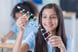 Young girl holding a model DNA strand