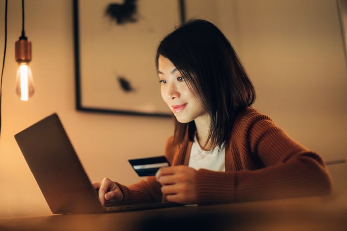 An online shopper gets ready to make a purchase on a laptop.