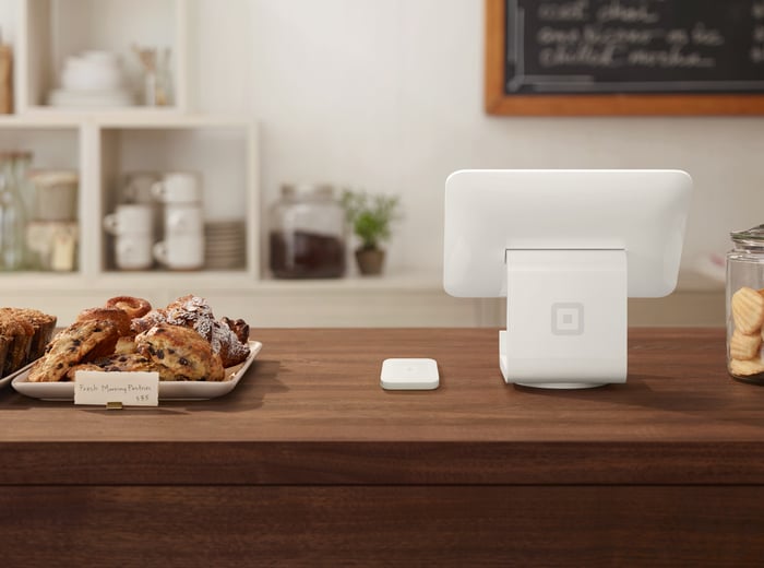 Square hardware at bakery checkout desk.