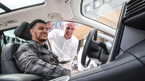 Nio customer sits in vehicle.