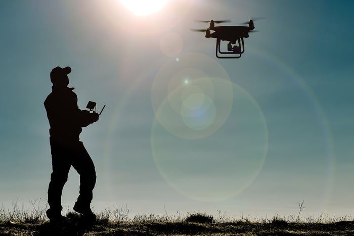 A person test-flying a drone.
