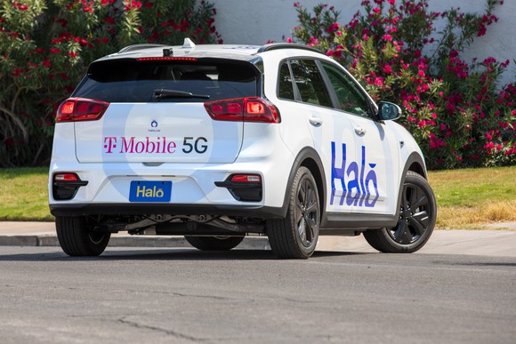 A halo self driving electric car viewed from the back.