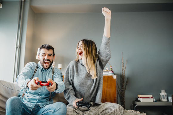 Two people having fun playing video games.