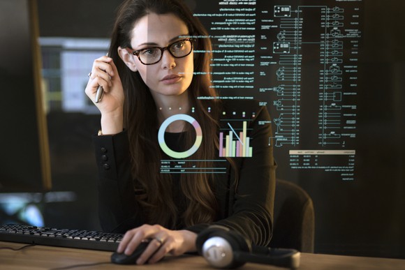 Woman analyzing data in an office.