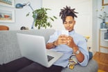 Teenager on a laptop and cell phone -- GettyImages-1226995514