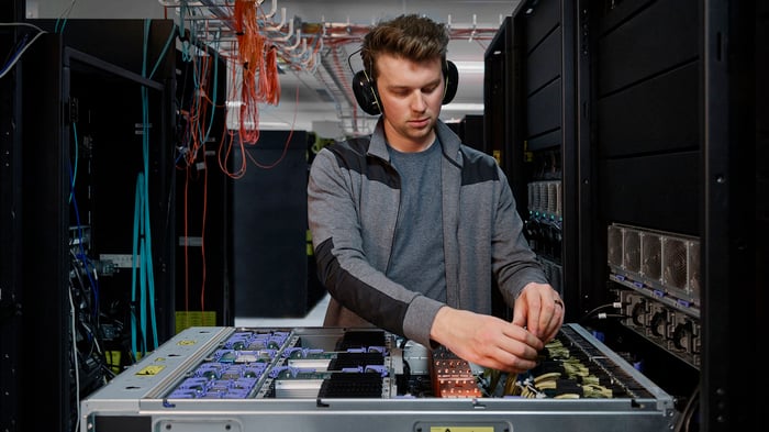 A person working on a Power E1080 server.