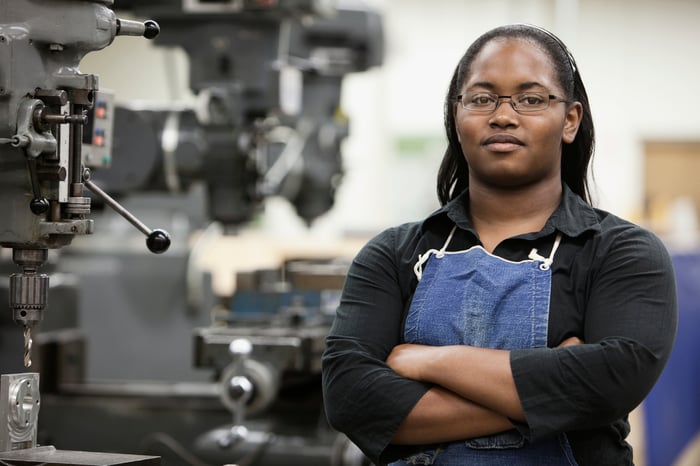 Worker stands at a tooling plant.