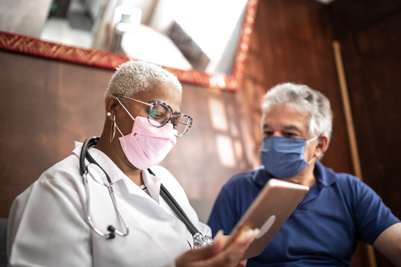 healthcare worker patient mask covid coronavirus pandemic tablet
