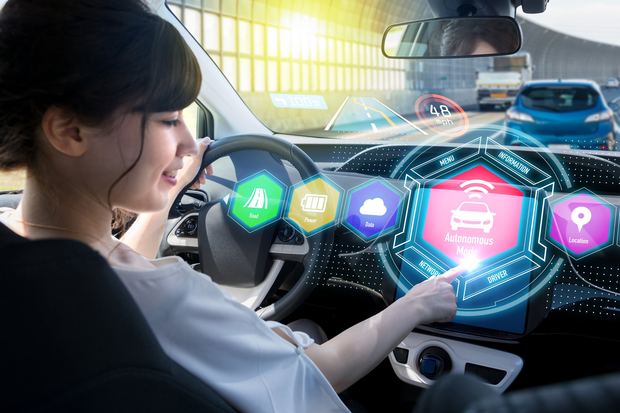 A person looking at a vehicle dashboard displaying autonomous concept.
