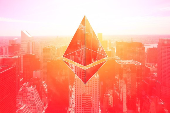 Ethereum logo in front of a cityscape.
