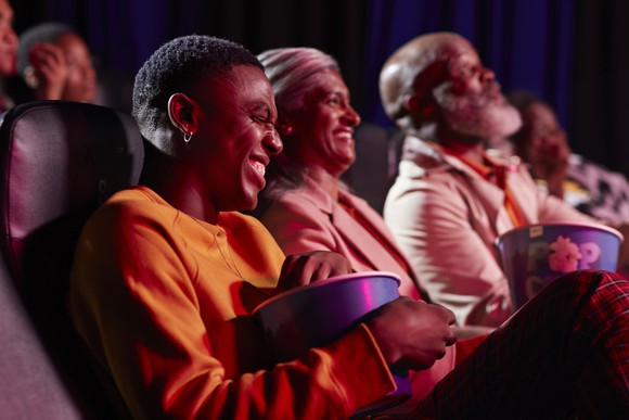A group of people in a movie theater.