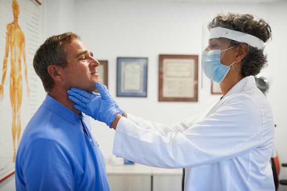 A patient meets with his doctor for an appointment.