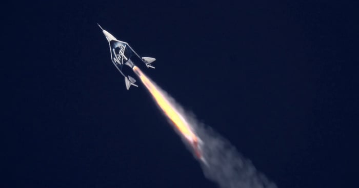 Virgin Galactic ship firing into space.