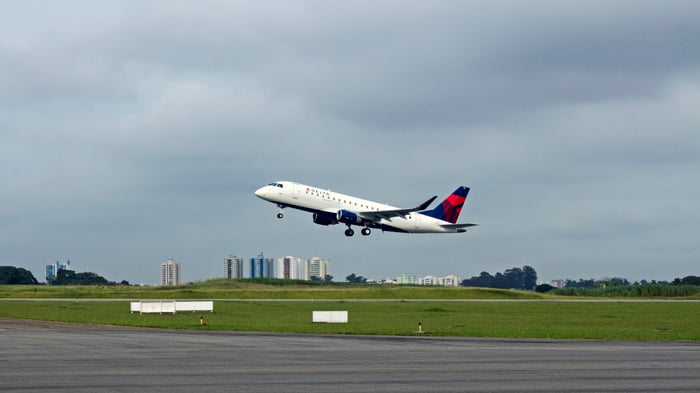 A SkyWest regional jet in Delta's livery preparing to land.