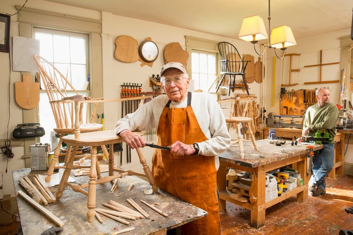 Person working on chair in workshop