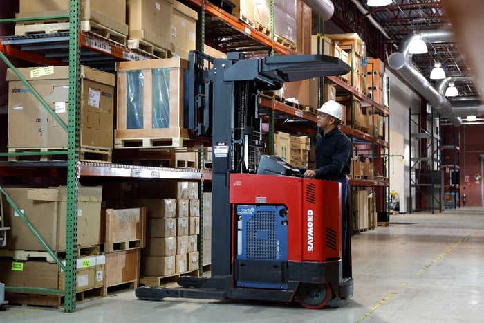 A Plug Power Gen Drive fuel cell powering a forklift in a warehouse.