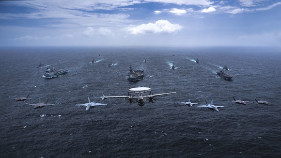 Naval fleet and airplanes including Japan Maritime Self-Defense Force multipurpose operation destroyer JS Kaga