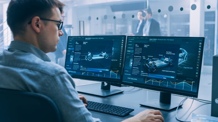 A design engineer using computer-aided design software.