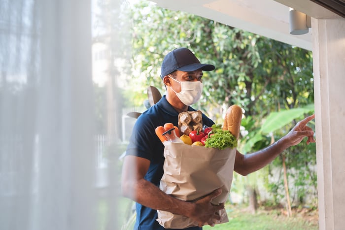 Person delivering groceries.