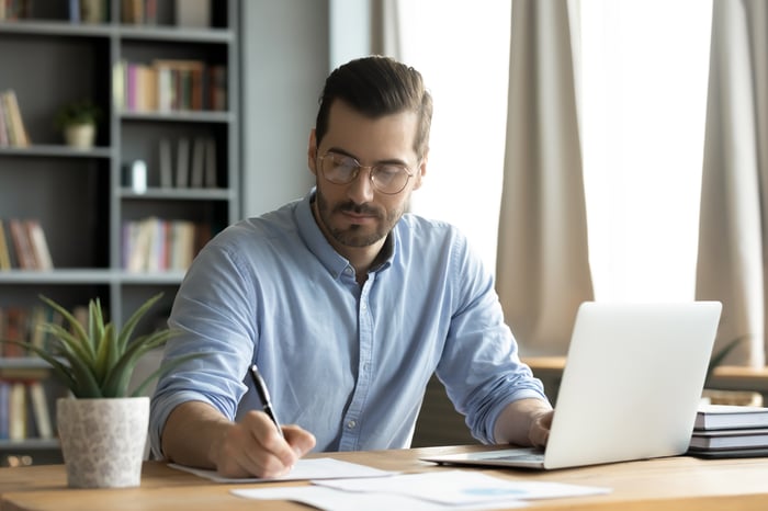 Person at the laptop who takes notes.