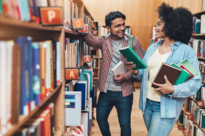 Two people in a bookstore.