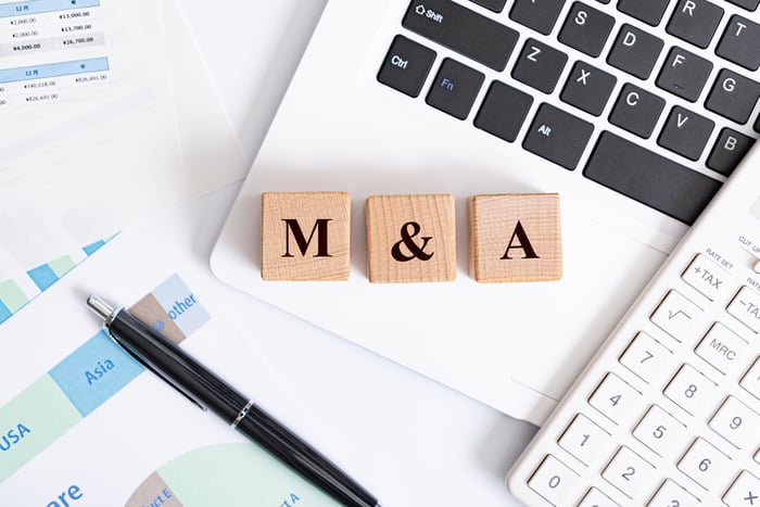 Wooden blocks spelling the phrase M&A.