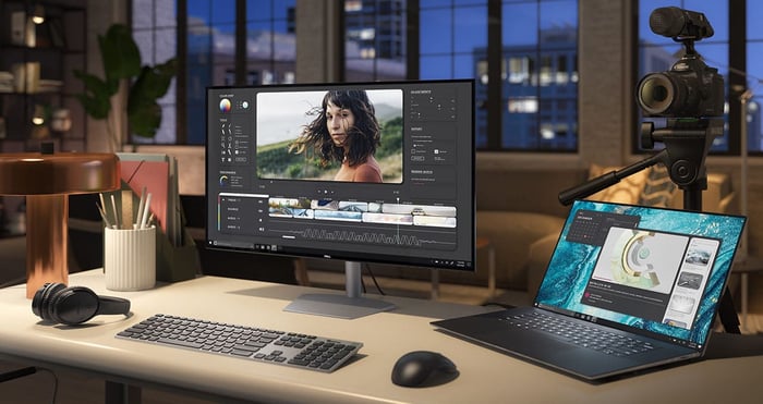 A computer sitting on a desk running graphics software.