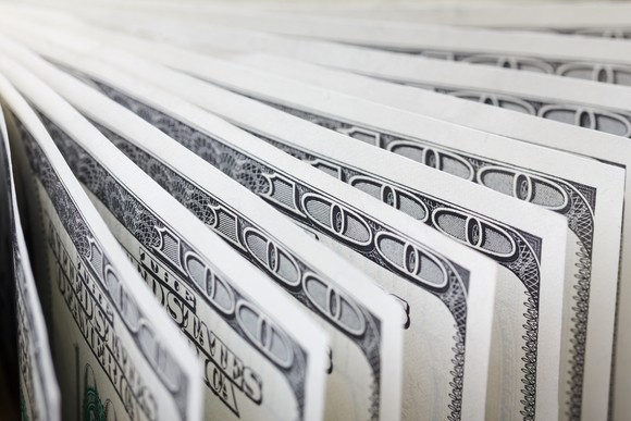 Hundred-dollar bills, fanned out.