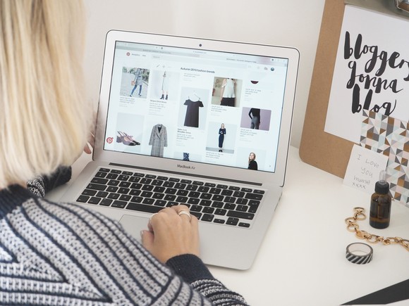 Someone using Pinterest on a laptop.