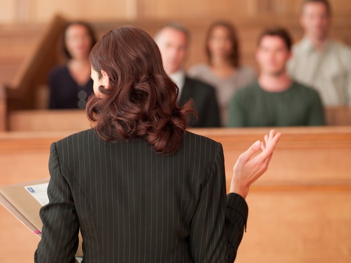 A person speaking to a jury.