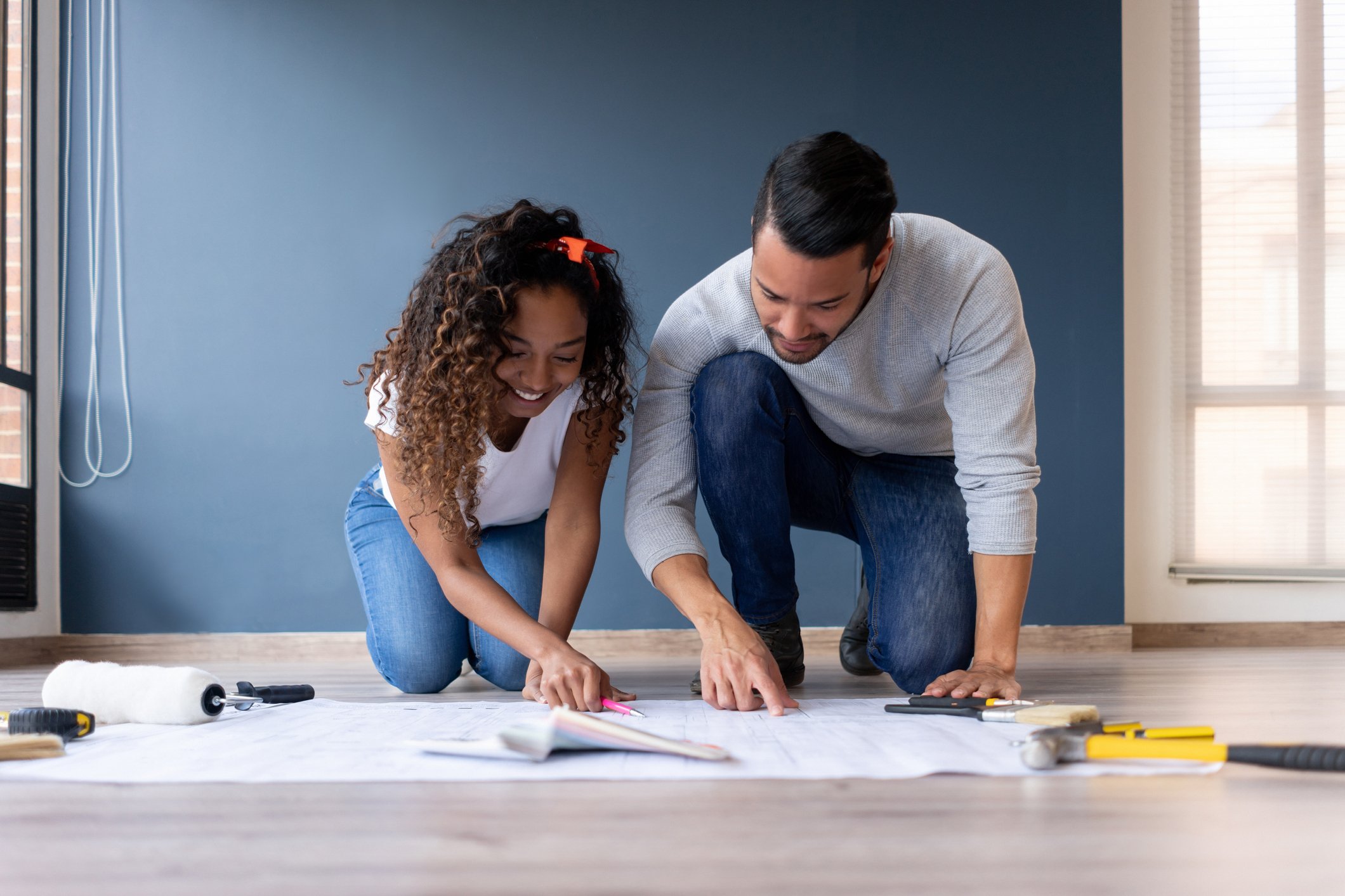 A man and woman working on a home improvement project