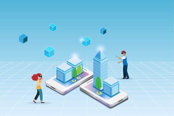 Two people stand on an empty space in front of two phones with buildings coming out of them.