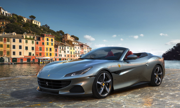 Steel gray Ferrari set against Italian canal background.