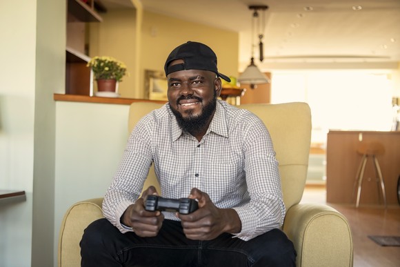 An adult playing a video game.