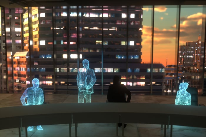 Digital outlines of three business people in an office meeting room with skyscrapers in background.