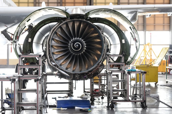 An aircraft engine receiving maintenance.